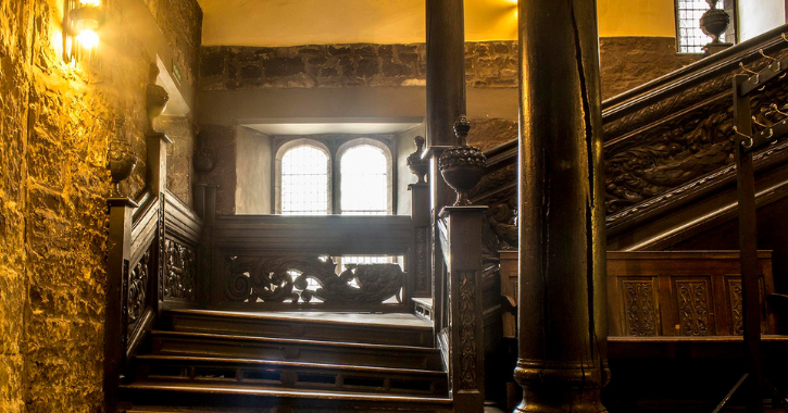 Black Stairs inside Durham Castle. Pineapple carvings.