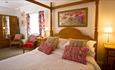 The Penny Red bedroom at The Old Post Office Durham with four poster bed